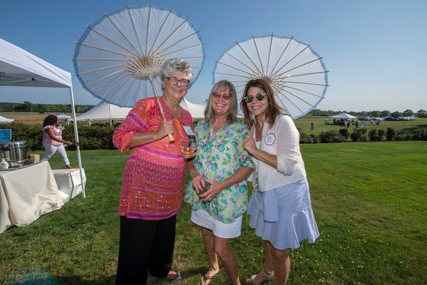 Carol Mulvihill-Ahlers, Dai Dayton and Casey Chalem Anderson during the annual Peconic Land Trust Gala at the Ocean View Farm in Bridgehampton on Sunday evening.