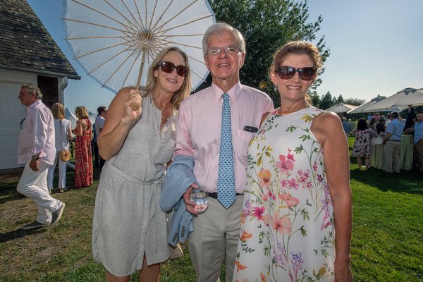 Bridget Fleming with Fred and NancyLynn Thiele during the annual Peconic Land Trust Gala at the Ocean View Farm in Bridgehampton on Sunday evening.