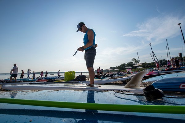 Ari Weller readies himself prior to the start of the annual Paddle for Pink at Havens Beach on Saturday morning.