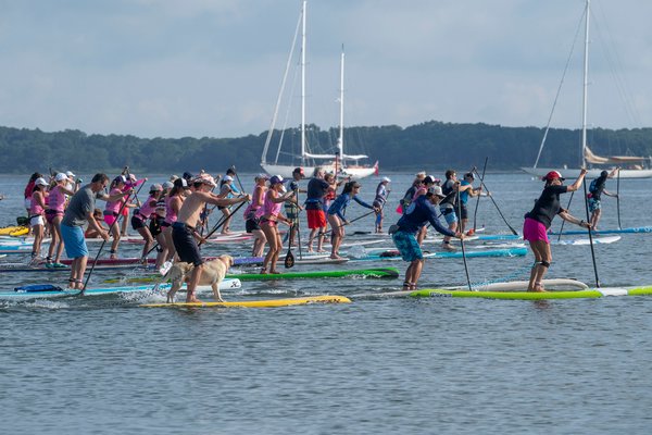 Paddlers leave the starting line during the annual Paddle for Pink at Havens Beach on Saturday morning.