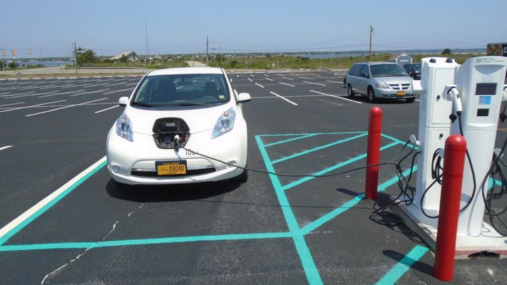 Car being charged at the Ponoquogue Beach EV charging station in Hampton Bays