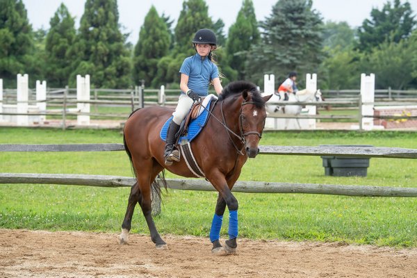 Nine-year-old Sadie Culver trains for competition at the Hampton Classic with her mount Young Blue at the Swan Creek Farm Stables in Bridgehampton on August 13.