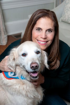 Author Jill Mangel Weisfeld with her therapy dog, Riley.