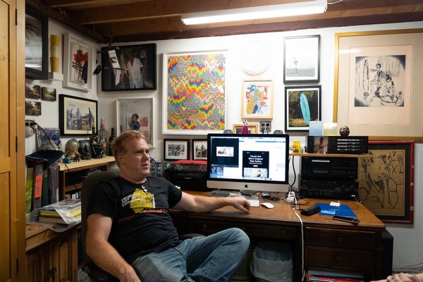 William Quigley sitting in his office, inside his East Hampton studio.