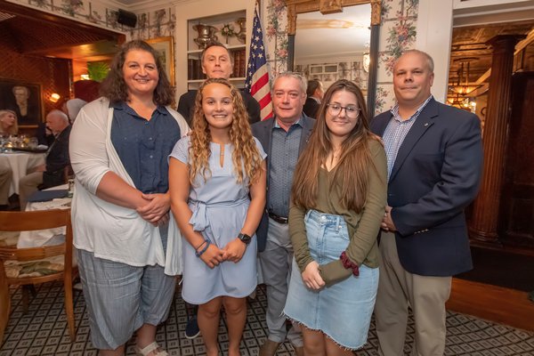 Lions Club Scholarship winners Nancy Hallock (on behalf of her daughter Emily), Paige Schaefer and Ella Knibb with Sag Harbor Lions Club members Paul Zaykowski, Tony Lawless and Mark Poitras during the Lions Club Awards Dinner at the American Hotel on July 24.