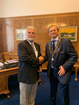 Aram Terchunian, left, of Westhampton Beach, presents Mayor Peter Baillie of Southampton, England with a proclamation. COURTESY ARAM TERCHUNIAN