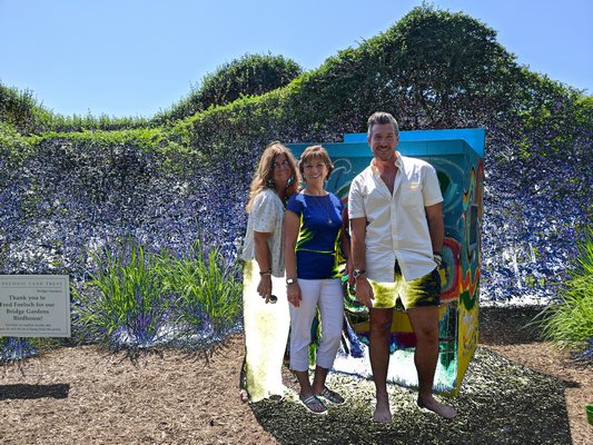 Christina Sahr (left), Kathy Kennedy and Aaron Goldschmidt in front of the birdhouse.
