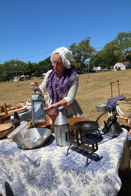 Diane Fish demonstrates camp cooking.