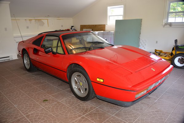 A red 1988 Ferrari was sold at a ope-house showing last week. The car was owned by the previous ower ad had registered less than 6,000 miles.      KYRIL BROMLEY