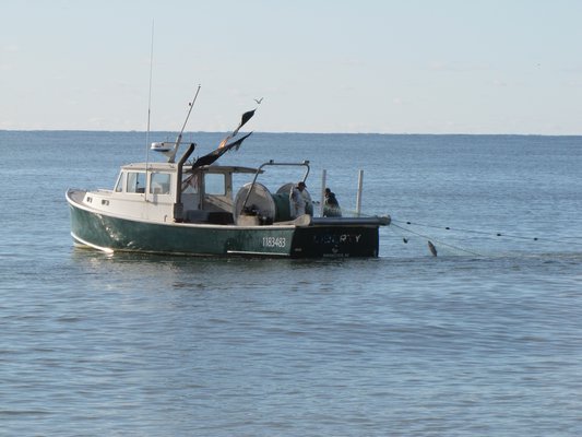 A commercial gillnet boat pulling up its net off Bridgehampton.