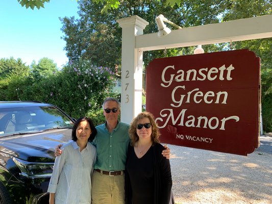 Sylvia Wong, left, who works at the firm that recently bought The Gansett Green Manor stands with Jed and Leslie Feldman, previous owners. BEN KAVA