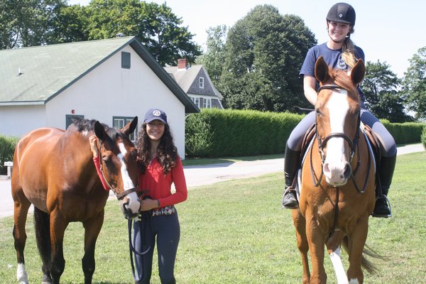 Ruby Yassen and her horse, Crucero, left, alongside Kathryn Powell and her horse, Carnuto, at Two Trees Farm earlier this month.