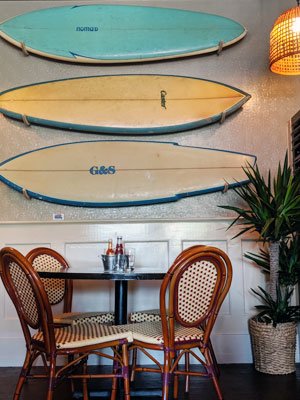 Colorful surfboards help set the scene for a seafood restaurant. JENNIFER CORR