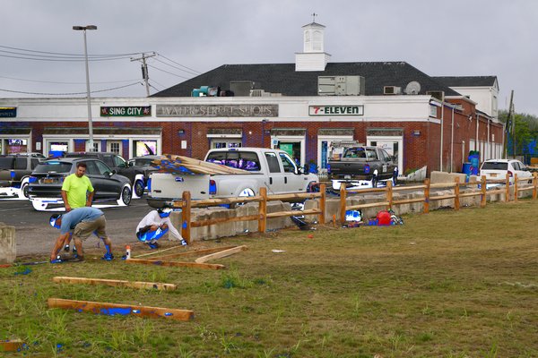 The Sag Harbor Village Department of Public Works begins to install a split rail fence around the John Steinbeck Waterfront Park.