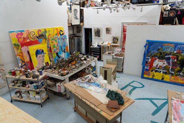 Works by William Quigley sits inside his studio.
