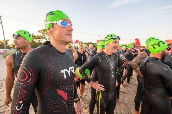 Joris Esch waits to go into the water prior to the start of the Mighty Hamptons Triathlon on Sunday morning.