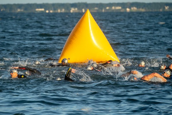 Swimmers start the 38th annual Mighty Hamptons Triathlon on Sunday morning.