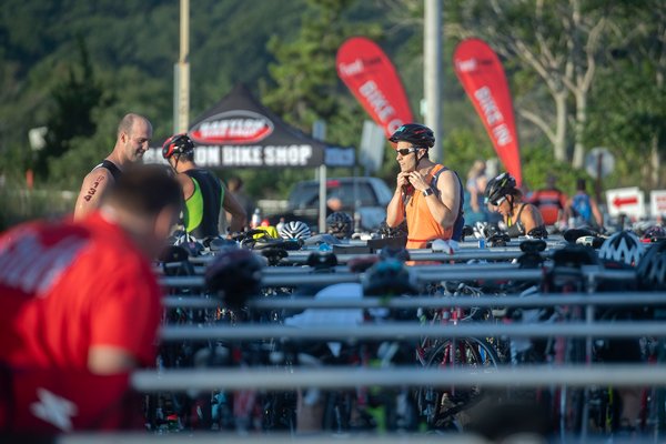 Competitors switch from swimming gear to biking gear in the transition area.