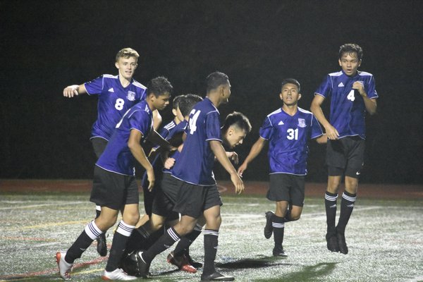 Milan Moraga is mobbed by his teammates after scoring what ended up being the only goal of the game in the 1-0 victory for the Baymen on September 10.