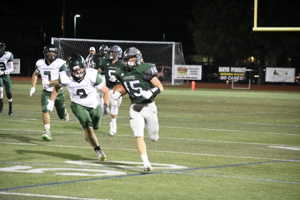 Westhampton Beach junior Aidan Cassara takes the opening kickoff to the second half to the end zone for a touchdown.