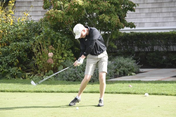 Westhampton Beach senior Coady Sumwalt tees off at the first hole at Westhampton Country Club on September 18.