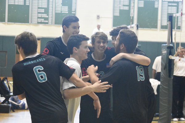 The Canes celebrate a point during their host tournament on Saturday.