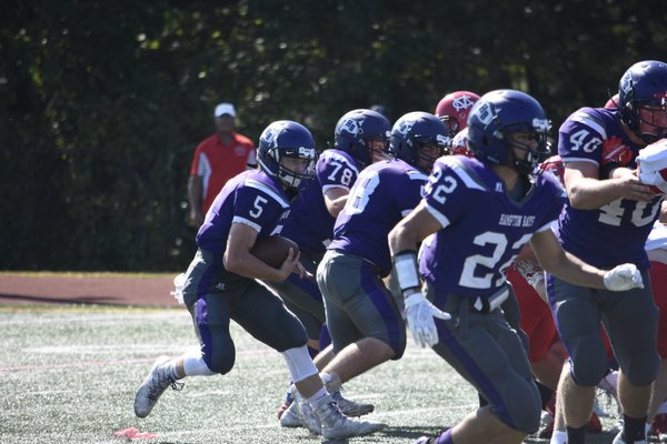 Hampton Bays junior Dakota Thompson looks for some running room with multipe blockers out in front of him.