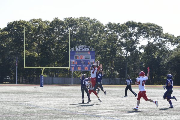 Baymen Lucas Brown (2) and Thomas Fassino break up a pass play.