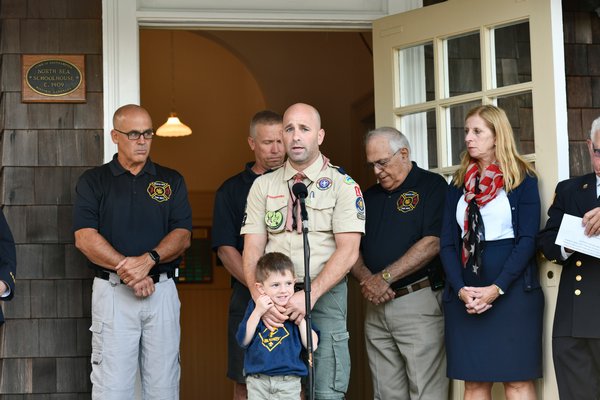 Scout Master Paul DelZatto speaks at the September 11 remembrance at the North Sea Community House on Wednesday morning.