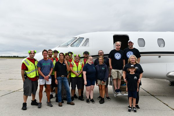 Volunteers and staff from ARF, the Sheltair ground crew, memebers of Jake's Rescue Ranch and pilots Tim Barrett and Jonathan Plesset from Pittsburgh Aviation Animal Rescue Team at Gabreski Airport on Thursday, September 12.