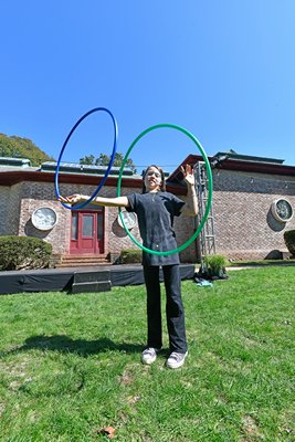 Emmajune Fennell spins hula hoops on the grounds of the Southampton Arts Center on Saturday.