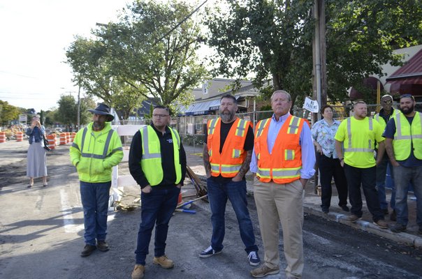 Center, from left to right: Village Department of Public Works Superintendent Matthew Smith, Board member Brian Tymann and Deputy Mayor Ralph Urban. ANISAH ABDULLAH