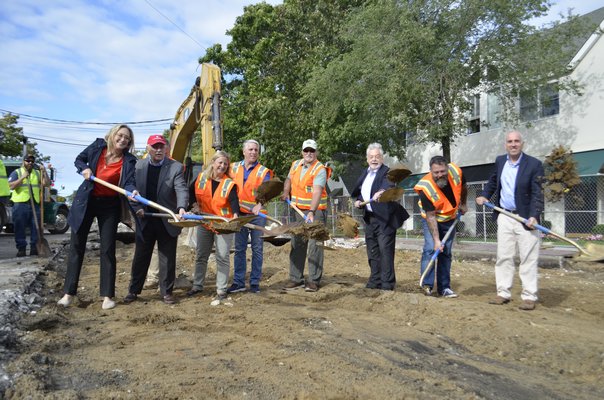 State, town, county and village officials celebrate the start of the Westhampton Beach Main Street reconstruction project Wednesday morning. ANISAH ABDULLAH
