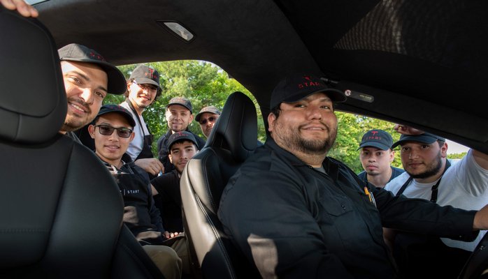 The first nine students to complete Suffolk County Community College’s Automotive Technology Program – the only program in the northeast certified to train Tesla START technicians – graduated on August 22. Two students from the East End completed the program. From left, Dustin Miller of East Hampton, Changling Zhang, Brandon Boyer, Nicholas Calderon, Mateo Salazar of Hampton Bays, Gilbert Correa, Christian Leonardo, Kevin Mejia, Orlando Collazo.