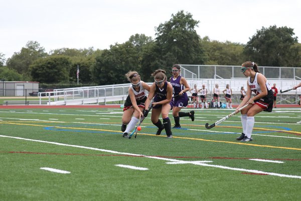 Pierson's Micky Wilson and Hampton Bays sophomore Brianna Diessler both go after the ball.