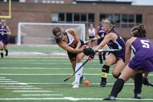 Pierson's Meredith Spolarich attempts a shot on goal with Hampton Bays junior captain Mia Mielenhausen trying to block it.