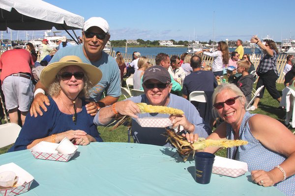 The Montauk Seafood Festvial was a popular draw last weekend. From left, Debbie and Bob DiSilvio, Peter Szczerba and Barbara Gengler.  KYRIL BROMLEY