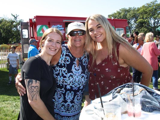 The Montauk Seafood Festvial was a popular draw last weekend. From left, Kaitlyn Soper, Liz Corrigan and Jessica Ducoing. KYRIL BROMLEY