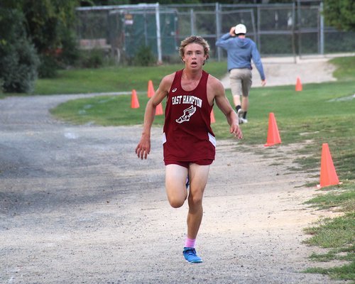 East Hampton sophomore Evan Masi was first to cross the finish line of the boys race.