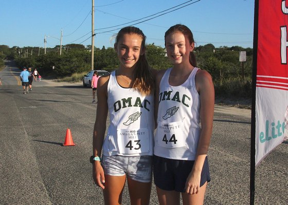 East Hampton cross country runners Bella Tarbet, left, and Ava Engstrom won the female mile, along with teammate Ryleigh O'Donnell, not pictured.