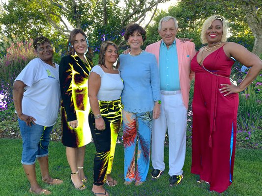 George and Patty Kraus hosted a fundraiser at their  Southampton home for New Hour, an organization dedicated to supporting women and children impacted by the justice system on Long Island. From left, New Hour member Deanna Pettaway, New Hour Executive Director Serena Liguori, New Hour member, Carol Madonia, New Hour founders Patty and George Kraus), and Topeka Sam of Ladies of Hope Ministries, which is collaborated with New Hour on various services. KIM COVELL
