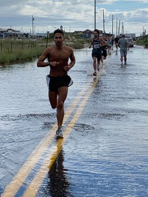 Runners for the 10K had to deal with a flooded portion of Dune Road.