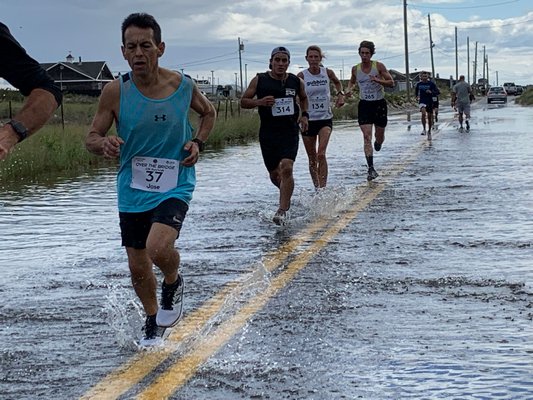 Runners for the 10K had to deal with a flooded portion of Dune Road.