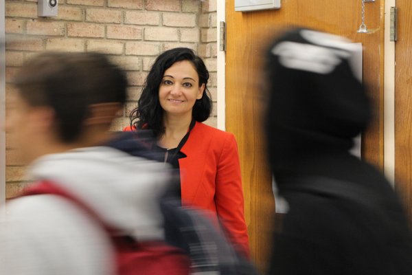 Dr. Alexandra Greenberg stands in the bustling halls of Hampton Bays each morning, between classes and at dismissal to connect with students.