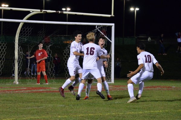 Joey Avallone is pumped up, and so are his teammates, after scoring the Mariners second goal of the game on Friday night, leading to their 2-0 victory at Center Moriches.