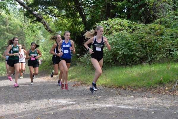 Ashley Steedman of Westhampton Beach runs at the front of one of the packs at the Jim Smith Invitational.