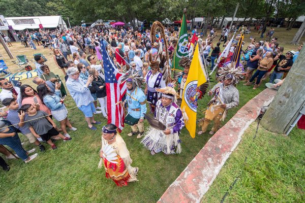 The Grand Entry makes its way towards the stage during the 2019 Shinnecock Powwow on Sunday.