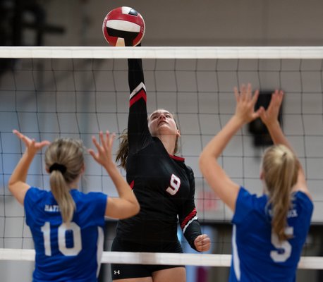 Pierson freshman Grace Flanagan tries to get the ball over the net.