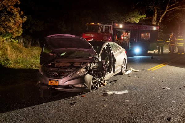 On the evening of August 27th, members of the East Hampton Fire Department responded with their “White Knights” heavy rescue company to Stephen Hands Path in the area of the LIRR trestle for a report of a two-vehicle motor vehicle accident with entrapment. The driver of one vehicle was transported to Southampton Hospital, the other was arrested at the scene for DWI. COURTESY MICHAEL HELLER