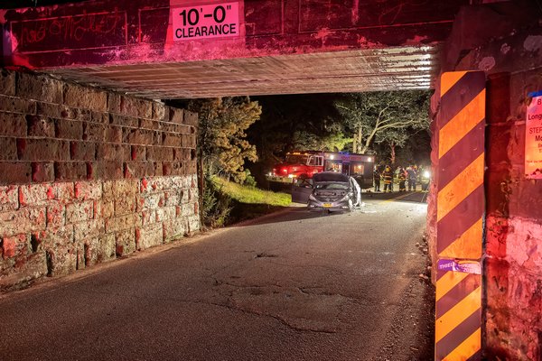 On the evening of August 27th, members of the East Hampton Fire Department responded with their “White Knights” heavy rescue company to Stephen Hands Path in the area of the LIRR trestle for a report of a two-vehicle motor vehicle accident with entrapment. The driver of one vehicle was transported to Southampton Hospital, the other was arrested at the scene for DWI. COURTESY MICHAEL HELLER
